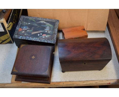 A 19th century mahogany tea caddy in casket form, a 19th century Oriental style musical jewellery box set with mother of pear