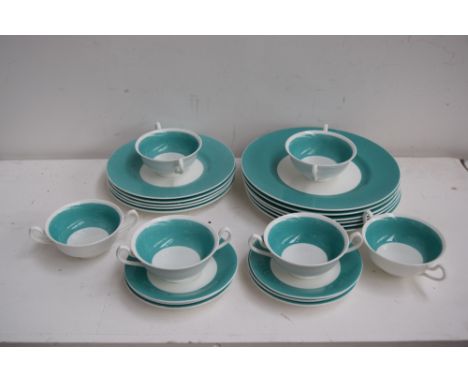A Minton part dinner service including soup bowls, side plates, dinner plates and saucers, turquoise rim design 