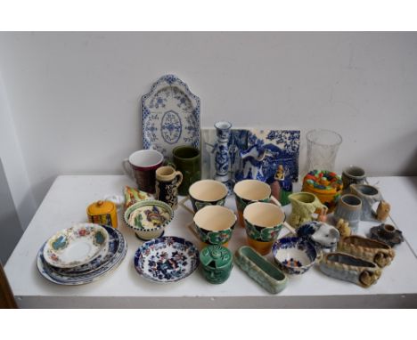 A set of four English Country Pottery mugs in the style of Clarice Cliff signed E.C.P.; Delft tiles,blue and whitw china, vin