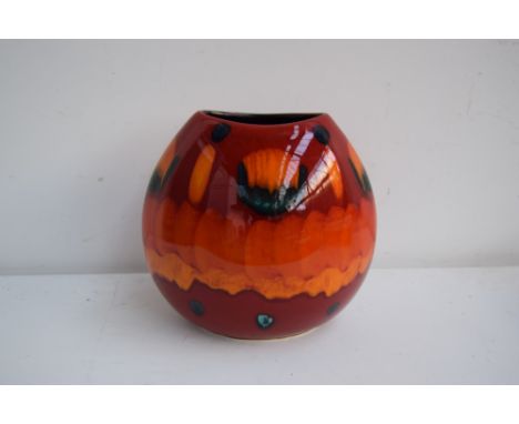 A hand painted 'Volcano' purse Poole Pottery vase, red, orange, green and blue glaze, marks impressed on base with original l