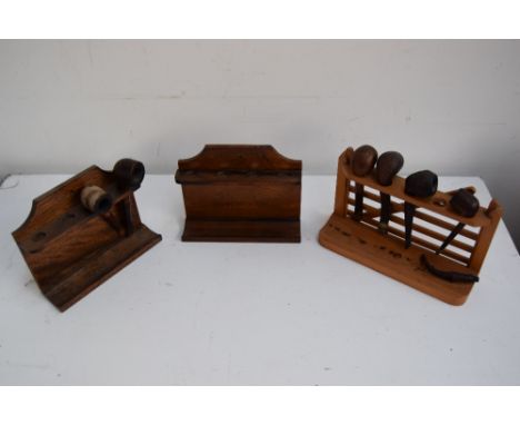 Three pipe racks with several pipes