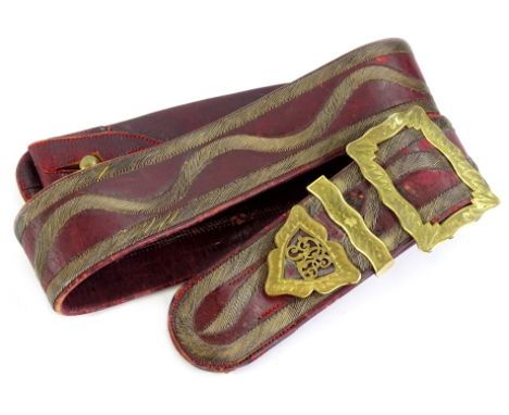 A Royal Engineer's sash, in red Moroccan leather with gilt buckle and RE badge, probably 19thC, bearing paper label to interi