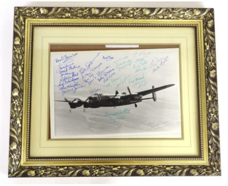 A Derrick Warren photograph of The City of Lincoln Lancaster Bomber, with many signatures including Les Smith, Leonard Cheshi