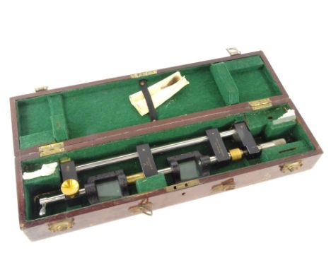 A military stereoscope universal bar-parallax by J M G &amp; Sons Ltd, serial/model no. B.615, in a mahogany case, 48cm wide.