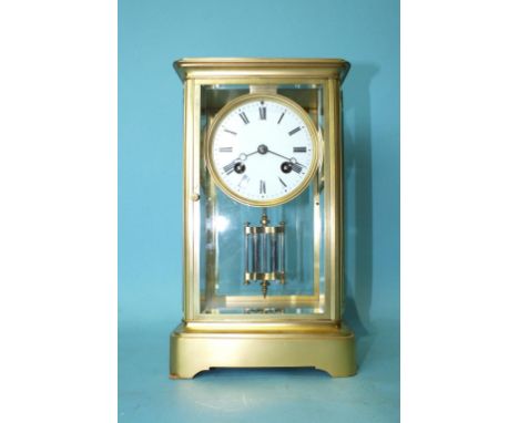 A late-Victorian four-glass gilt brass mantel clock, the bell-striking drum movement with circular enamel dial and mercury-fi