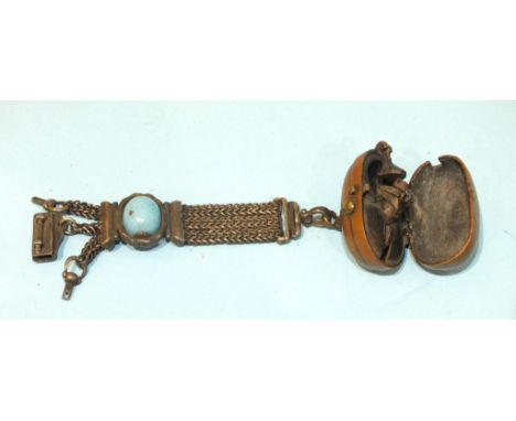 A Japanese small tinder box netsuke (Hiuchi), Meiji Period (1868-1912), of oval form, with iron action, the hinged copper cas