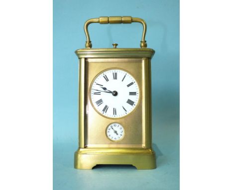 A 19th/20th century French brass alarm-repeater carriage clock, the circular enamel dial and alarm subsidiary with gong-strik