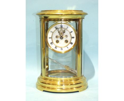 A 19th century four-glass mantel clock of oval outline, the bell-striking drum movement, mercury-filled pendulum and two-piec