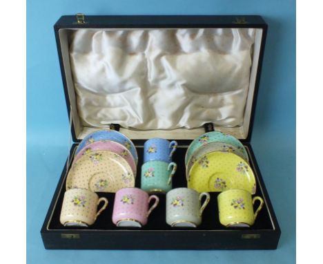 A cased set of six Spode Copeland coffee cups and saucers in the 'Old Concord' pattern, in six different pastel colours, with