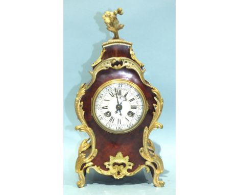 A 19th century French tortoiseshell and gilt metal mantel clock, with enamel dial and gong-striking drum movement, 30cm high.