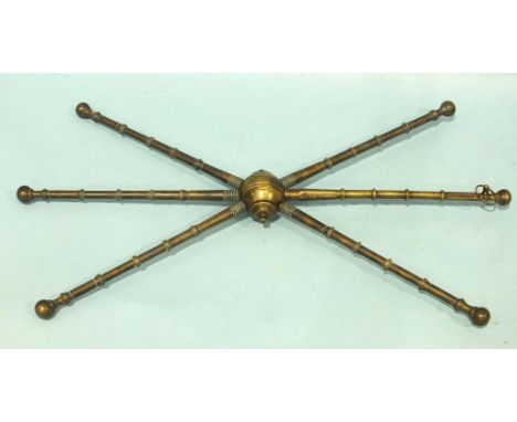 A 19th century brass plate stand or 'cart', with central hub and six ring-turned legs, one stamped Pratts Patent with stamped