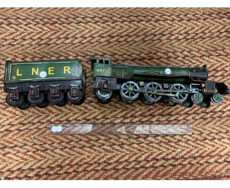 A LARGE TIN PLATE STEAM ENGINE FLYING SCOTSMAN AND LNER TENDER 