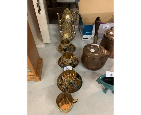 A VINTAGE SAMURAI JAPANESE TEA SET COMPRISING OF A TEAPOT, MILK JUG, SUGAR BOWL AND THREE CUPS AND SAUCERS AND A FURTHER CUP 