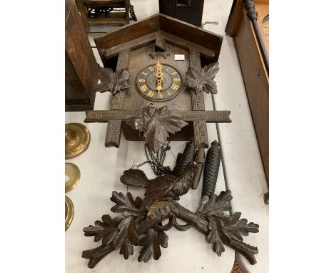 A BAVARIAN STYLE CUCKOO CLOCK IN NEED OF REPAIR 