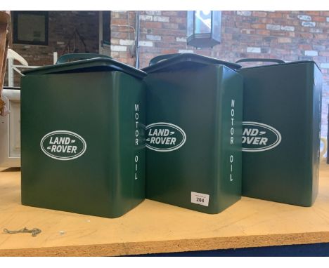 A SET OF THREE GRADUATED VINTAGE STYLE REPRODUCTION METAL LAND ROVER GREEN MOTOR OIL PETROL CANS 