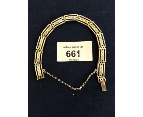 A SILVER MARKED 800 GRADE BRACELET WITH BLUE ENAMEL DETAIL 