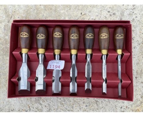 A CROWN TOOLS SEVEN PIECE BUTT CHISEL SET WITH STAINED BEECH HANDLES IN BOX - UNUSED/LITTLE USED 