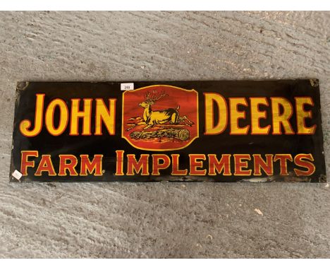 AN ENAMEL 'JOHN DEERE FARM IMPLEMENTS' SIGN 
