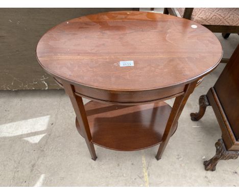 AN OVAL MAHOGANY SIDE TABLE WITH LOWER SHELF 