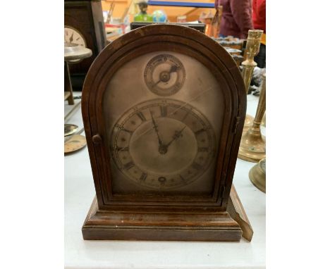 A CHIMING MANTLE CLOCK IN NEED OF REPAIR 