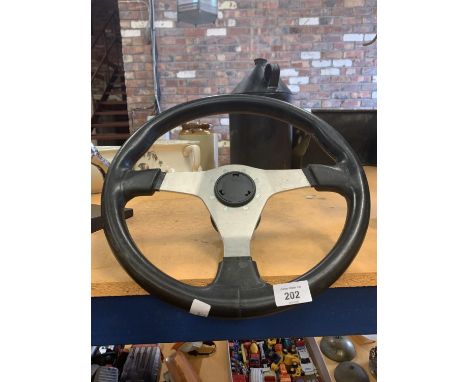 A VINTAGE STEERING WHEEL 