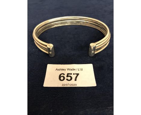 A SOLID SILVER MARKED TORQUE BANGLE WITH DIAMOND SET ENDS, APPROX TOTAL GROSS 58 GRAMS 