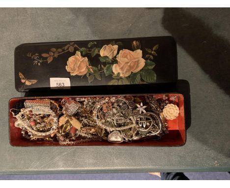 AN ASSORTMENT OF COSTUME JEWELLERY WITHIN AN EBONISED GLOVE BOX WITH FLORAL DECOUPAGE DECORATION 