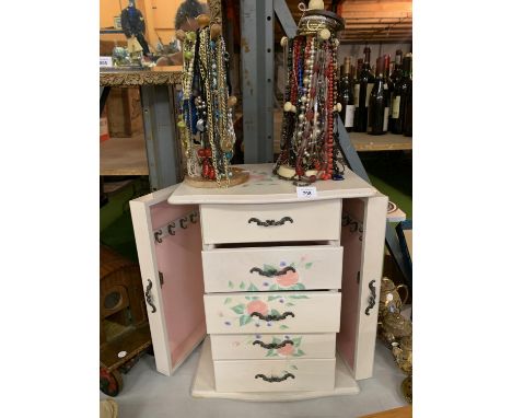 A LARGE DECORATIVE JEWELLERY BOX WITH DRAWERS AND DOORS AND TWO TREE STANDS WITH COSTUME BRACELETS AND NECKLACES 