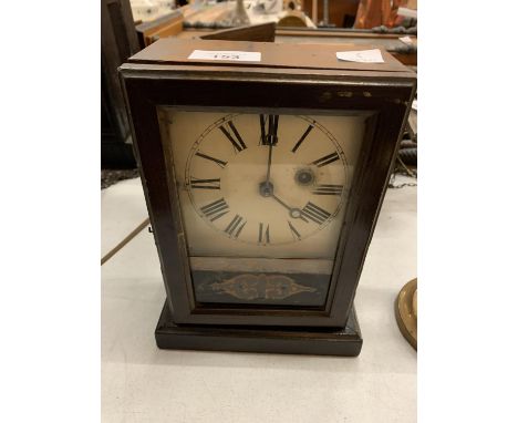 A CHIMING MANTLE CLOCK IN NEED OF REPAIR 