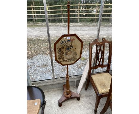AN OCTAGONAL BAGPIPER TAPESTRY ON A MAHOGANY STAND 