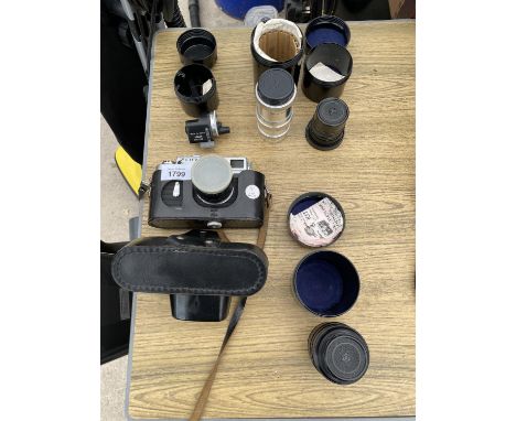 A ZORKI 4K CAMERA WITH FIVE VINTAGE SOVIET ERA LENSES WITH CASES AND SOME ORIGINAL DOCUMENTATION 