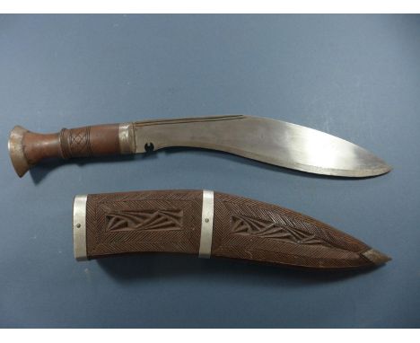 A KUKRI KNIFE WITH CARVED SCABBARD - 28 CM BLADE 