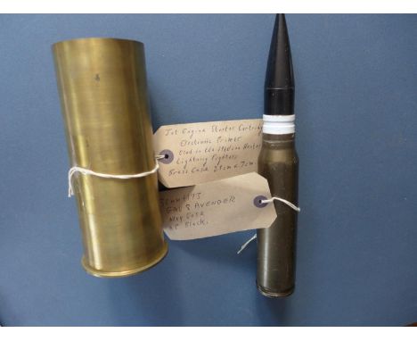 A JET ENGINE STARTER CASE AND A 30 MM GAU 8 AVENGER SHELL 
