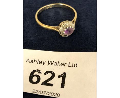 A 9CT GOLD PURPLE AND AND WHITE STONE CLUSTER RING SIZE Q APPROX TOTAL GROSS WEIGHT 2 GRAMS 