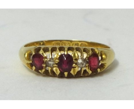 An 18ct ruby and diamond set ring, size M, also a cameo brooch, set in yellow metal mount, height 30mm (2).