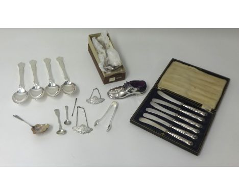 A collection of silver plated flatware, two silver spirit labels, sugar tongs, two silver spoons, Butler six setting canteen 