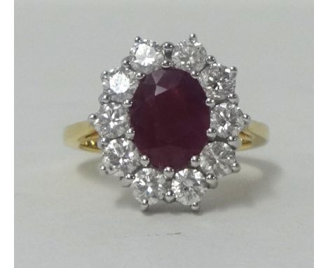 18ct yellow gold cluster ring with 2.5ct ruby and approx 2ct of diamonds