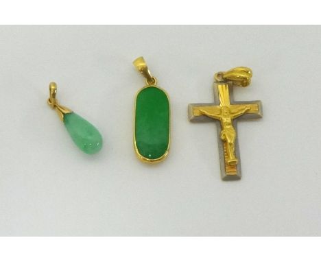 Two jade and gold pendants and a gold cross (3).
