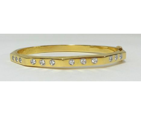An 18k diamond set bangle, approx 0.60 carats, clarity judged to be VVS1/VVS2, colour G/H.