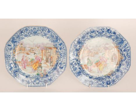 Two 19th Century octagonal Chinese export plates each enamel decorated with a young boy holding a bird on a branch being watc