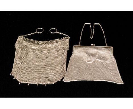 A 1920s hallmarked silver chain mail purse with engine turned snap clasp and fancy link chain, import marks for London 1924, 