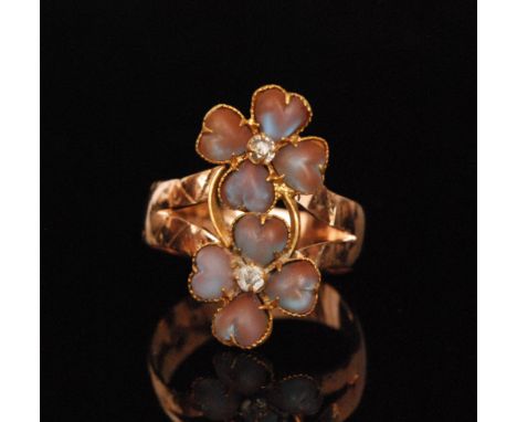 A 9ct hallmarked rose gold ring with a later double opal and paste set flower head, shank Chester 1901, ring size U.