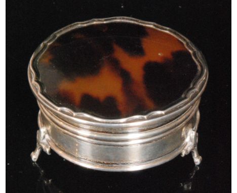 An early 20th Century hallmarked silver and tortoiseshell circular trinket box of plain form, hinged lid opening to velvet li