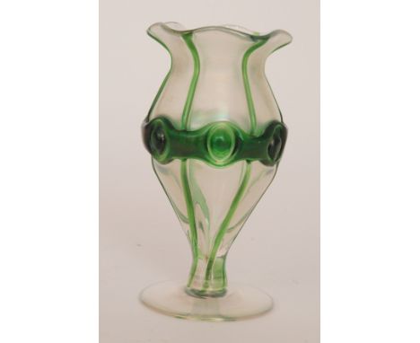 An early 20th Century Kralik glass vase of footed ovoid form with a frill rim, decorated with applied green strapping over th
