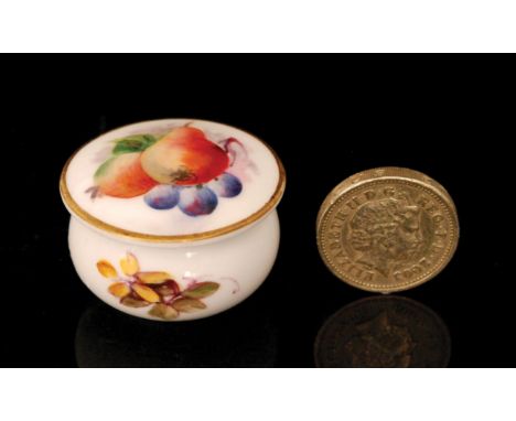 A small Royal Worcester rouge pot decorated to the cover with hand painted pears and cherries, the base with sprigs of foliag
