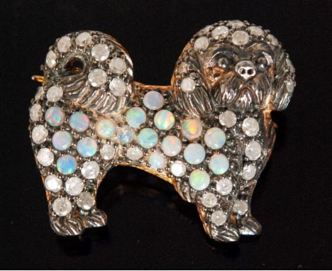 A silver gilt diamond and opal brooch modelled as a standing pug dog, length 2.5cm. 