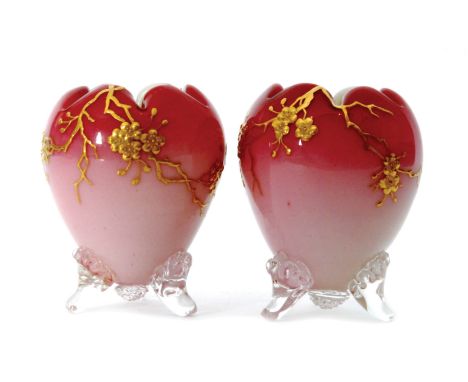 A pair of late 19th Century Thomas Webb & Sons peach bloom vases of ovoid form cased in a graduated pink over opal and relief