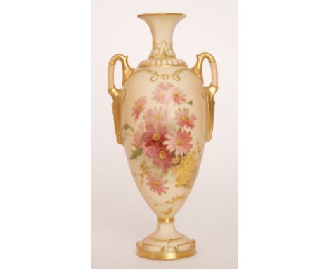 A Royal Worcester twin handled shape 2256 blush ivory pedestal vase decorated with a spray of pink and yellow flowers, the ha