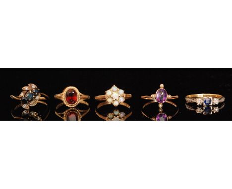 Five mid 20th Century stone set rings to include sapphire and diamond, garnet and opal examples, various styles, S/D.  