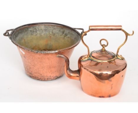 A copper twin handled preserve pan together with two swing handled cauldrons and frame, three trays and a brass ladle, (7)